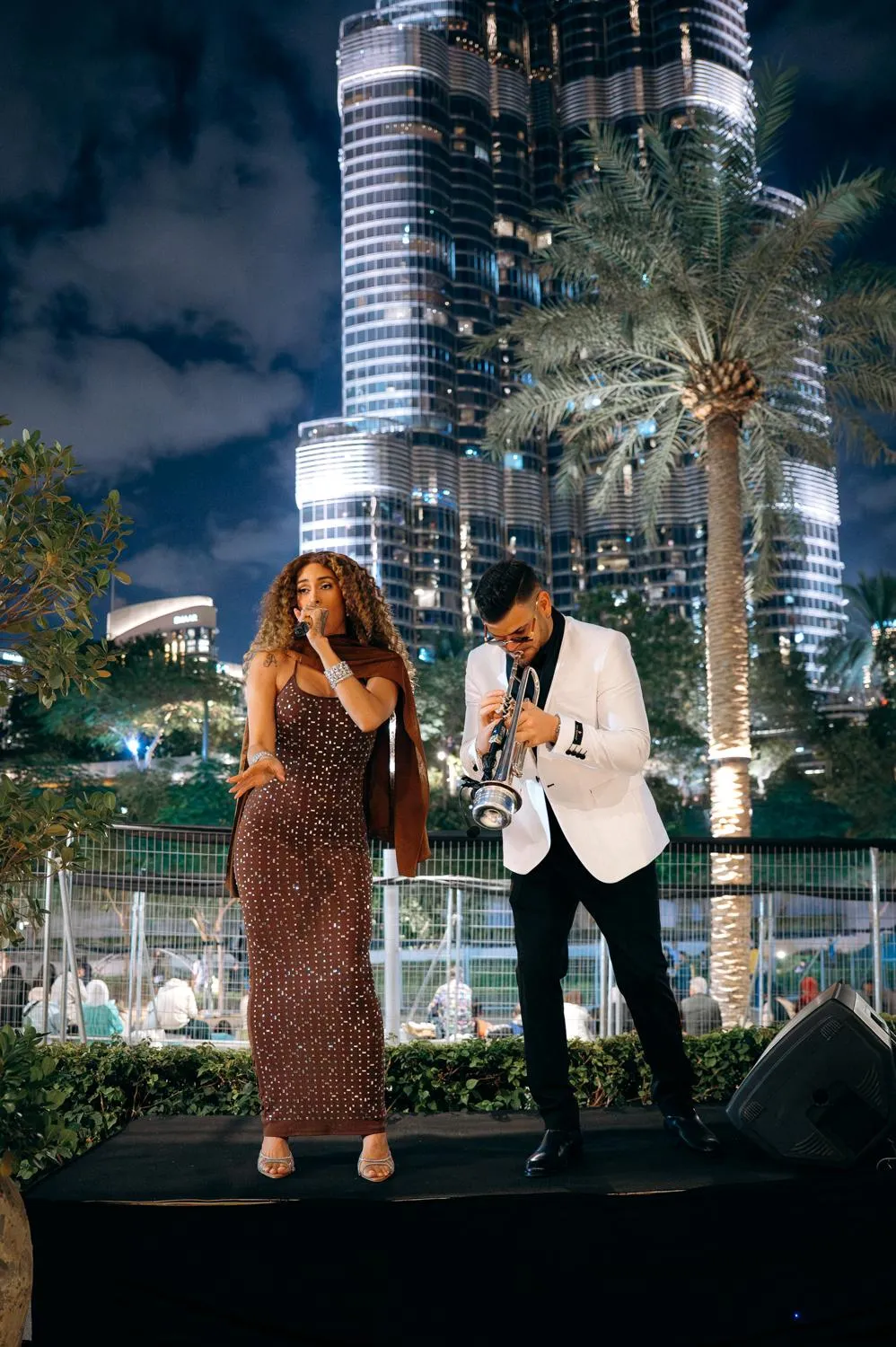 Darien Polo performing live trumpet with a singer at a private event